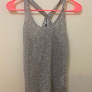 Sheer gray razor back tank top represents glitter